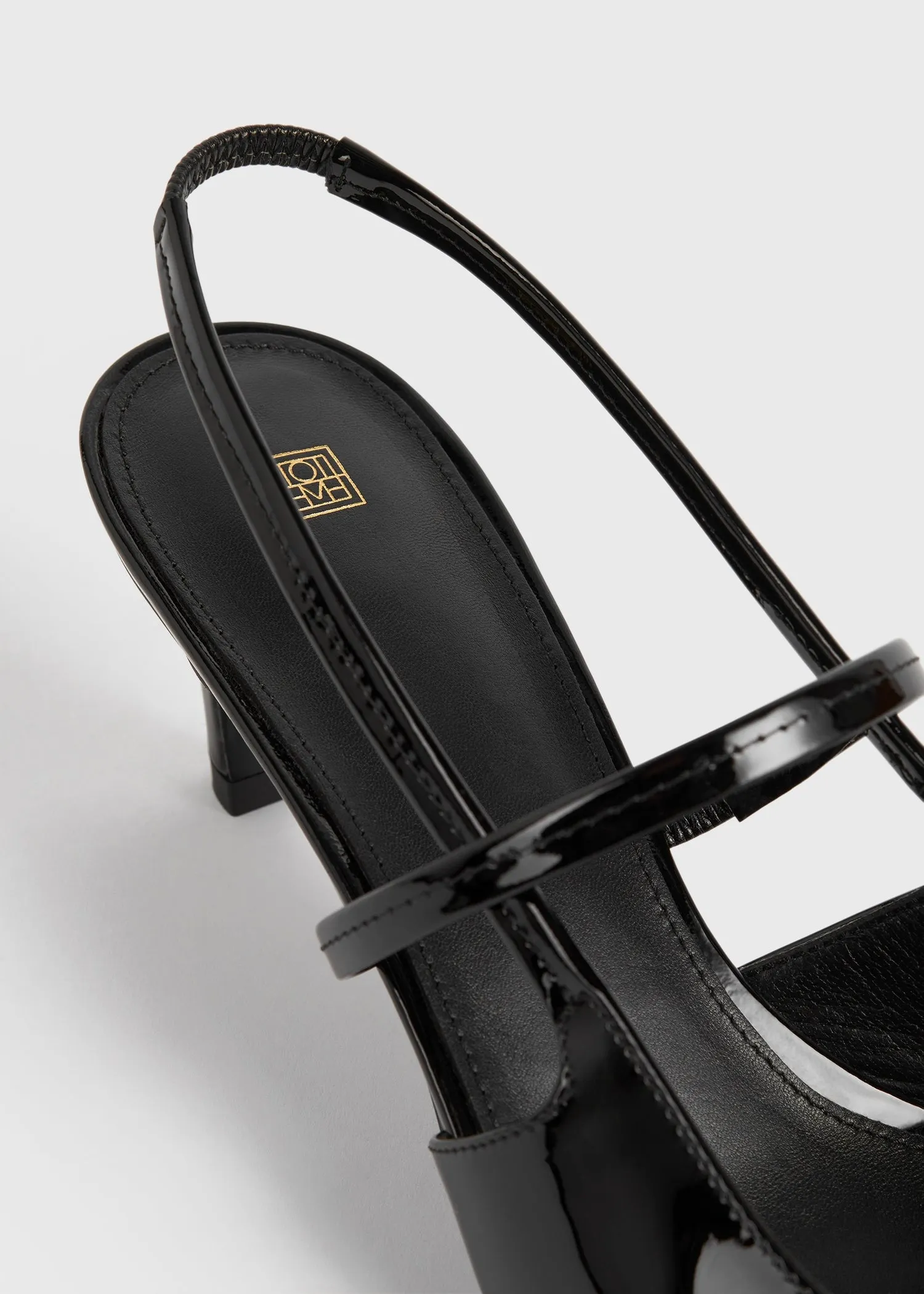 Sharp patent-leather slingbacks black